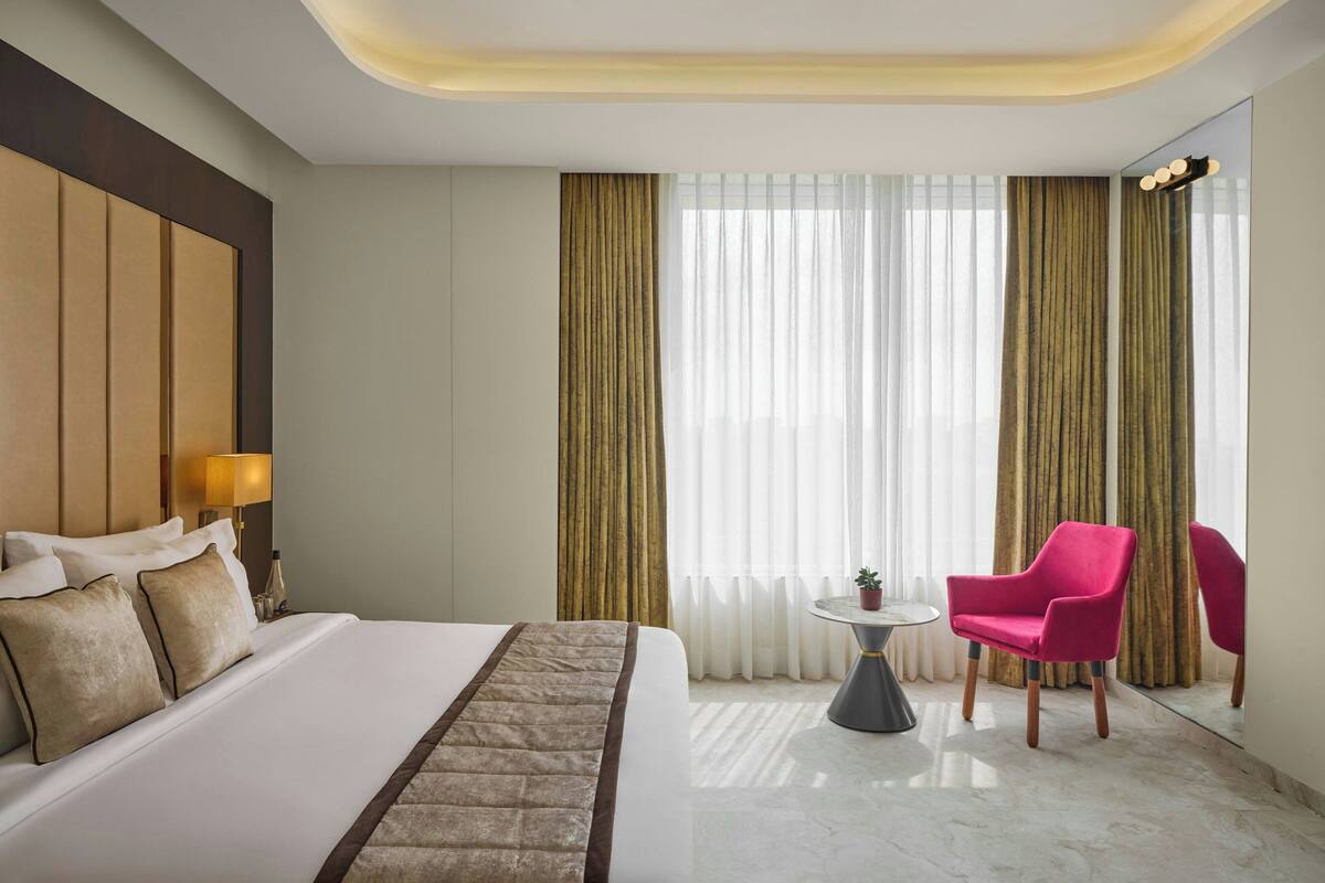 Suite, 1 King Bed, City View | In-room safe, desk, iron/ironing board, free WiFi