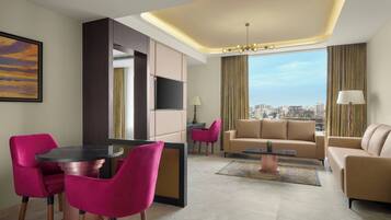 Suite, 1 King Bed, City View | Living room