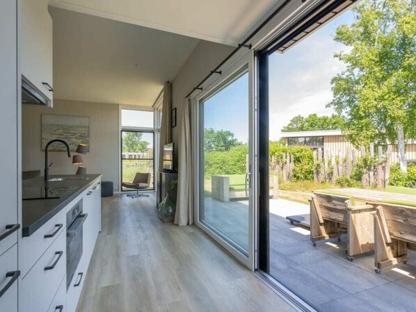 Interior - Enjoy the outdoors in this luxury chalet at Duinvilla’s Schouwenduin with a large sliding door, high (BURGH-HAAMSTEDE)