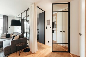 Deluxe Apartment, Kitchenette, Beachside | Laptop workspace, iron/ironing board, free WiFi