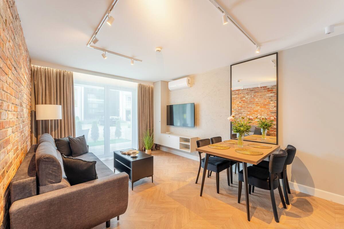 Deluxe Apartment | Living area | Flat-screen TV