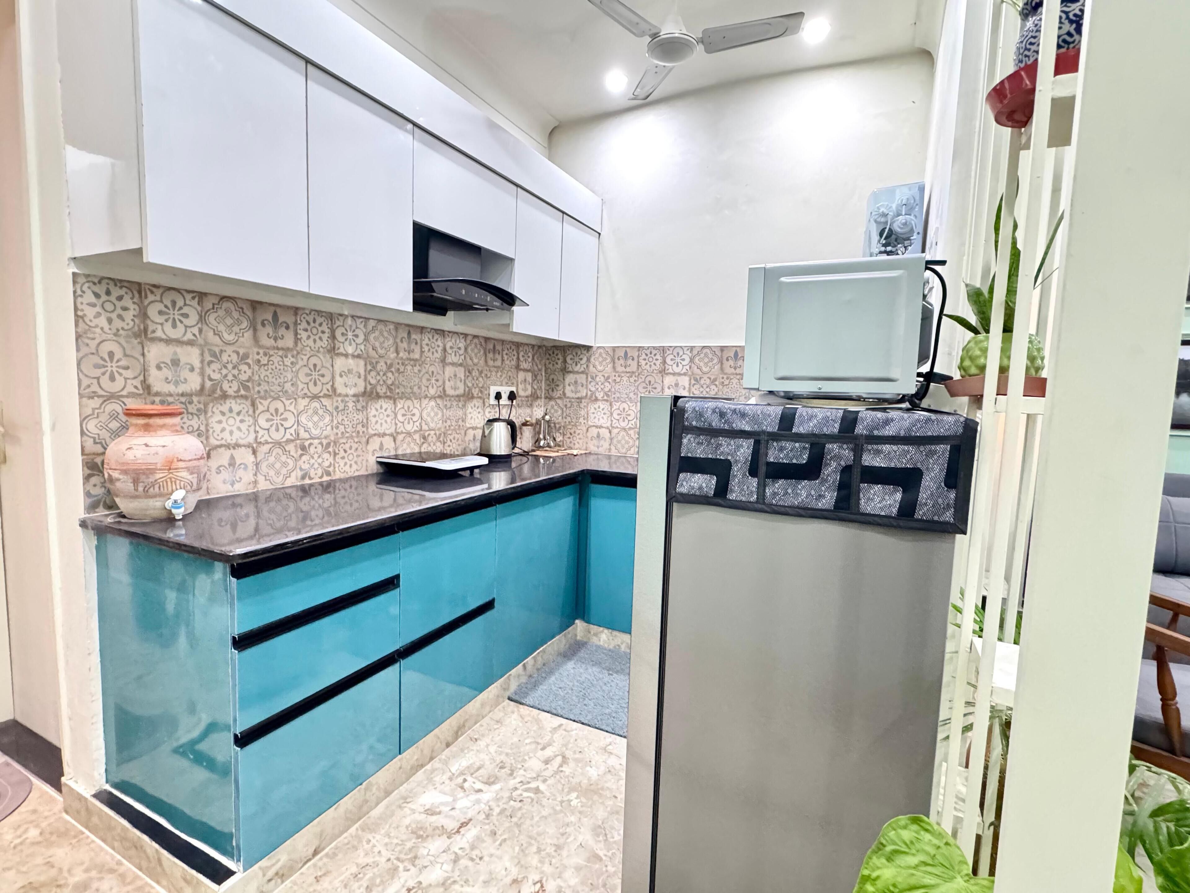 Fridge, microwave, electric kettle, cookware/dishes/utensils