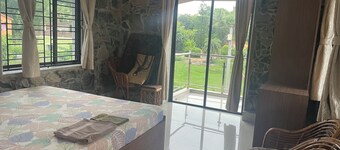 Stone bungalow amidst nature with plunge pool, bathtub, badminton court, barbq