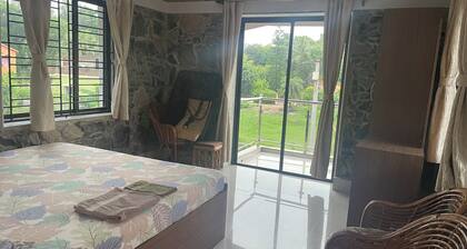 Stone bungalow amidst nature with plunge pool, bathtub, badminton court, barbq