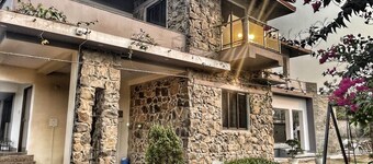 Stone bungalow amidst nature with plunge pool, bathtub, badminton court, barbq