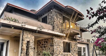 Stone bungalow amidst nature with plunge pool, bathtub, badminton court, barbq
