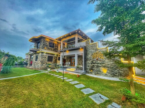 Stone bungalow amidst nature with plunge pool, bathtub, badminton court, barbq