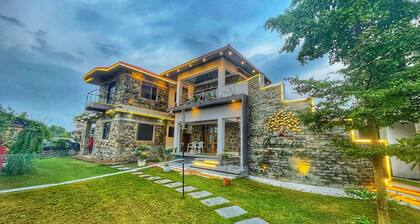 Stone bungalow amidst nature with plunge pool, bathtub, badminton court, barbq