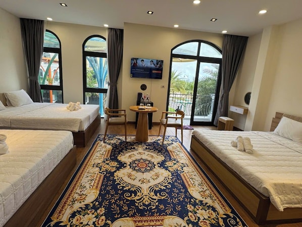 Family Room, Multiple Beds, Balcony, Garden View | Desk, free WiFi, bed sheets