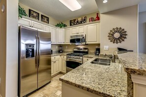 Fridge, microwave, oven, stovetop - Shoreline Splendor Haven: 2BR Condo with High-Speed WiFi (North Myrtle Beach)