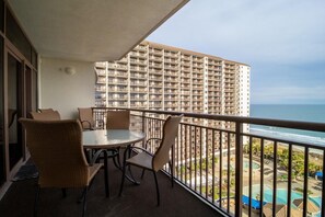 Outdoor dining - Shoreline Splendor: 3-Bedroom Oceanfront Condo with Modern Opulence (North Myrtle Beach)