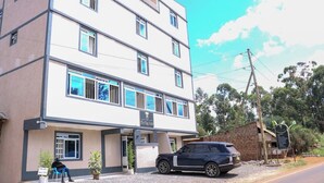 A multi-story hotel with a sign reading "The Tag Hotel". - The Tag Hotel  (Juja)