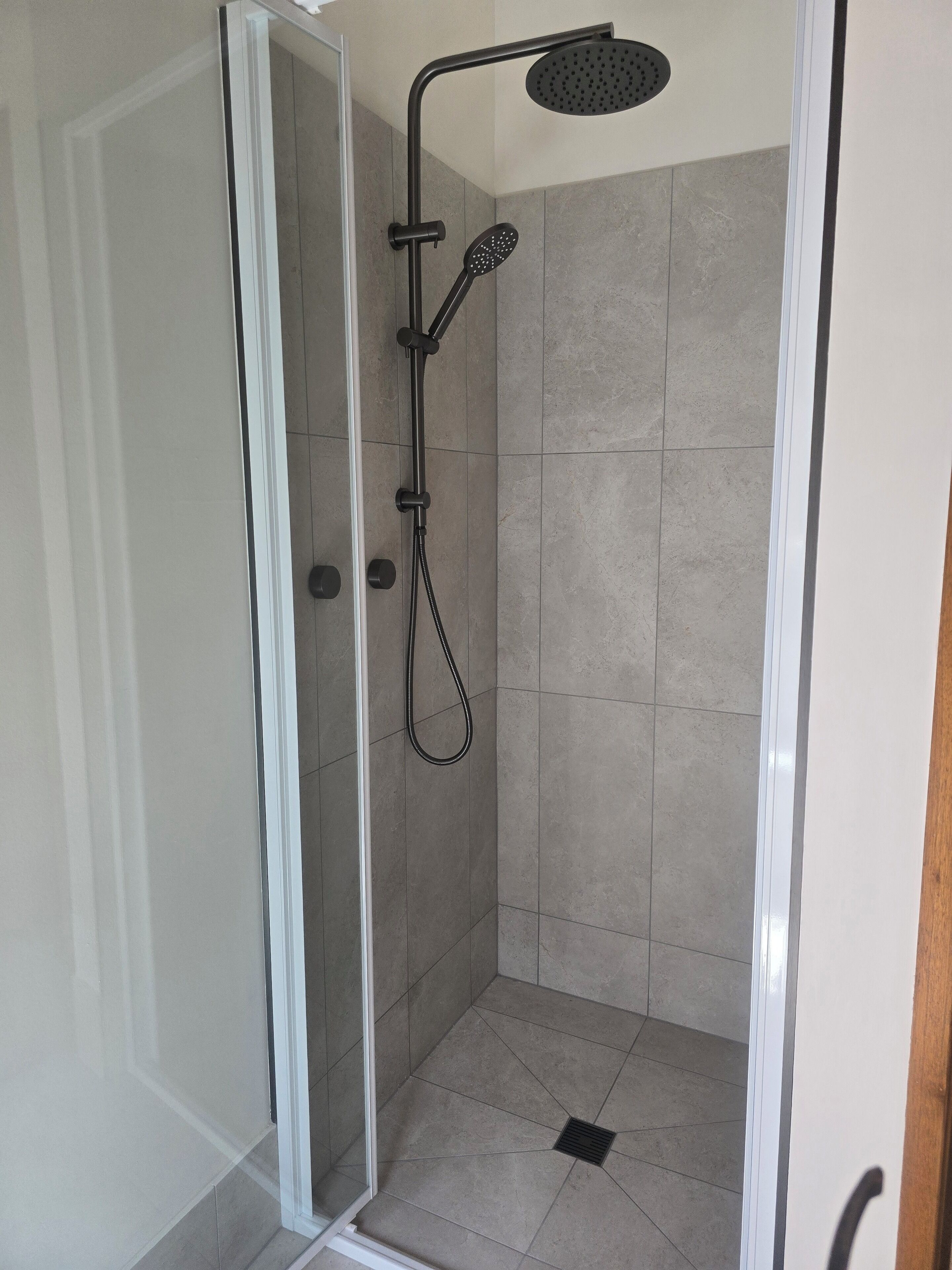 Shower, towels, soap, toilet paper