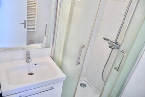 Shower, towels, soap, toilet paper