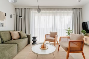 Premium Apartment, Kitchenette, Beachside | Laptop workspace, iron/ironing board, free WiFi
