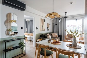 Premium Apartment, Kitchenette, Beachside | Laptop workspace, iron/ironing board, free WiFi