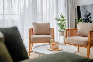 Premium Apartment, Kitchenette, Beachside | Laptop workspace, iron/ironing board, free WiFi