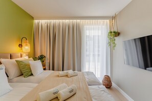 Premium Apartment, Kitchenette, Beachside | Laptop workspace, iron/ironing board, free WiFi