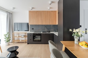 Premium Apartment, Kitchenette, Beachside | Laptop workspace, iron/ironing board, free WiFi