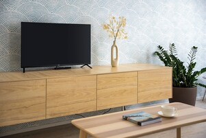 Deluxe Apartment | Living area | TV