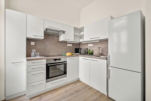 Comfort Apartment | Private kitchen | Fridge, microwave, oven, stovetop
