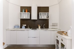 Fridge, electric kettle, toaster, cookware/dishes/utensils