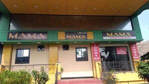 A building with the sign "MAMA LODGING & BOARDING" and "ROOMS AVAILABLE" displayed on the facade. - Mama Lodging and Boarding (Margao)