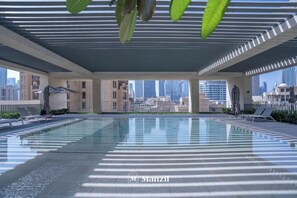 Outdoor pool - Manzil-2BR with full Burj Khalifa View (Dubai)
