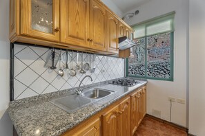 Fridge, microwave, stovetop, coffee/tea maker