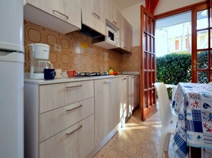 Fridge, microwave, stovetop, cookware/dishes/utensils