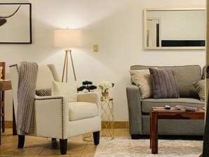 Apartment, Balcony, Garden View | Living area | 55-inch Smart TV with digital channels