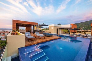 Pavilion rooftop with heated pool, gym, jacuzzi and BBQ area