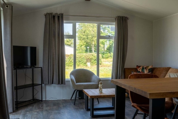 Living room of Holiday Park De Zeeuwse Parel - Sunset