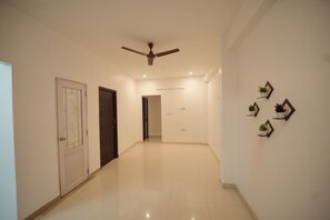 Two-Bedroom Apartment with City View | Living area | 32-inch LED TV with satellite channels - JR Service Apartment  (Coimbatore)