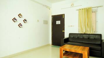 One-Bedroom Apartment with City View | Living area | 32-inch LED TV with satellite channels