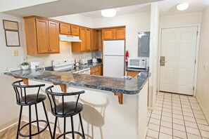 Condo, 2 Bedrooms | Private kitchen | Fridge, oven, coffee/tea maker, toaster