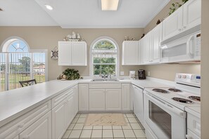 Condo, 2 Bedrooms | Private kitchen | Fridge, oven, coffee/tea maker, toaster