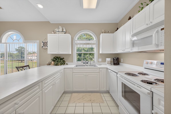 Condo, 2 Bedrooms | Private kitchen | Fridge, oven, coffee/tea maker, toaster