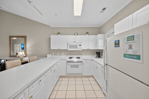 Condo, 2 Bedrooms | Private kitchen | Fridge, oven, coffee/tea maker, toaster