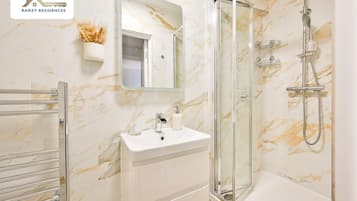 Shower, hair dryer, towels, soap