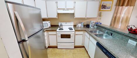 Condo, 2 Bedrooms | Private kitchen | Fridge, oven, coffee/tea maker, toaster