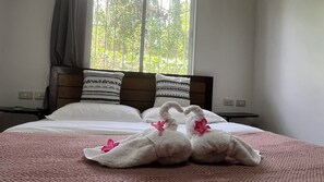 Basic Triple Room, Garden View | Desk, laptop workspace, free WiFi