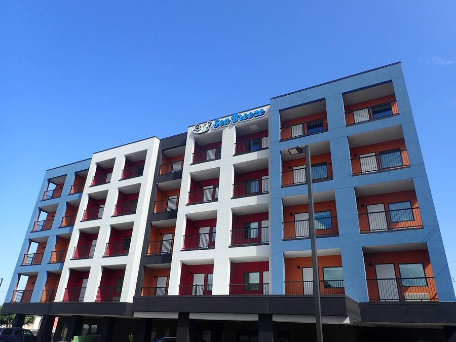 A multi-story building with a sign reading "Sea Breeze."