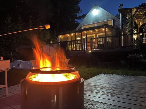 Chic lakefront retreat with year-round charm. Enjoy Lake Barnabee views, a fully stocked kitchen, and cozy vibes in a nostalgic lake community. Kayak in summer, skate in winter, and take advantage of fun in-home concierge services.