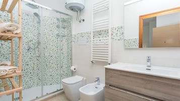 Shower, free toiletries, hair dryer, slippers