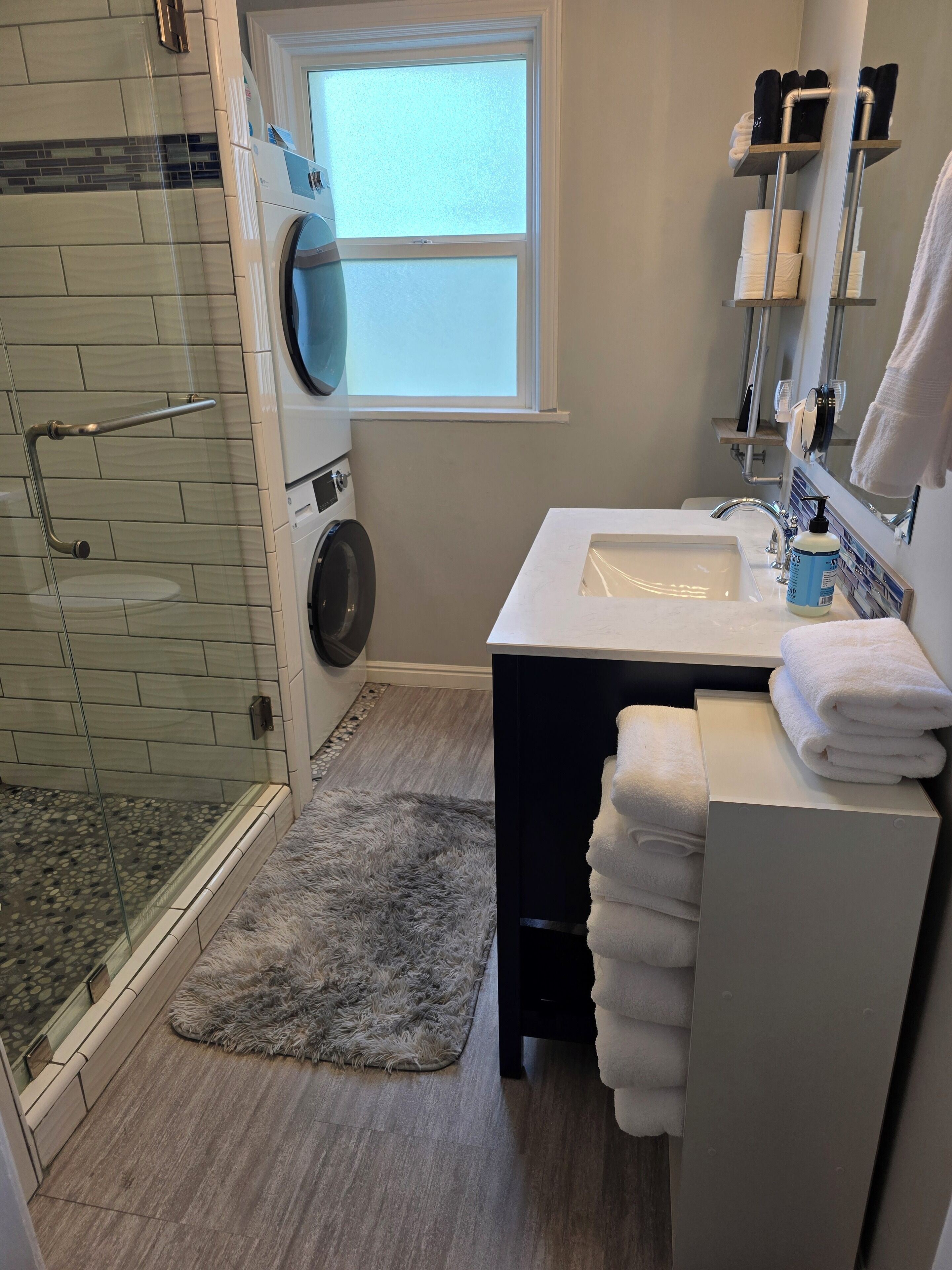 Shower, hair dryer, towels, soap