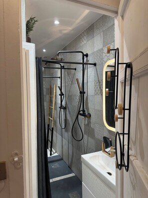 Shower, hair dryer, towels, soap