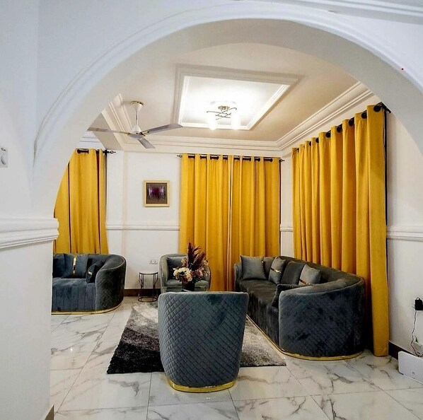 Quarto executivo | Área de estar | TV de tela plana