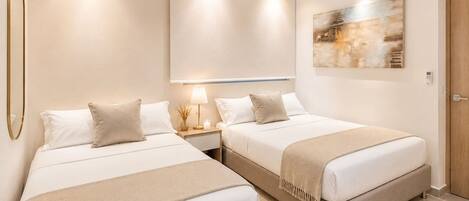 A hotel room with two beds, a wall-mounted air conditioner, and a painting.