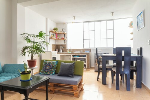 Baños Downtown Comfy  apartment - work area & laundry